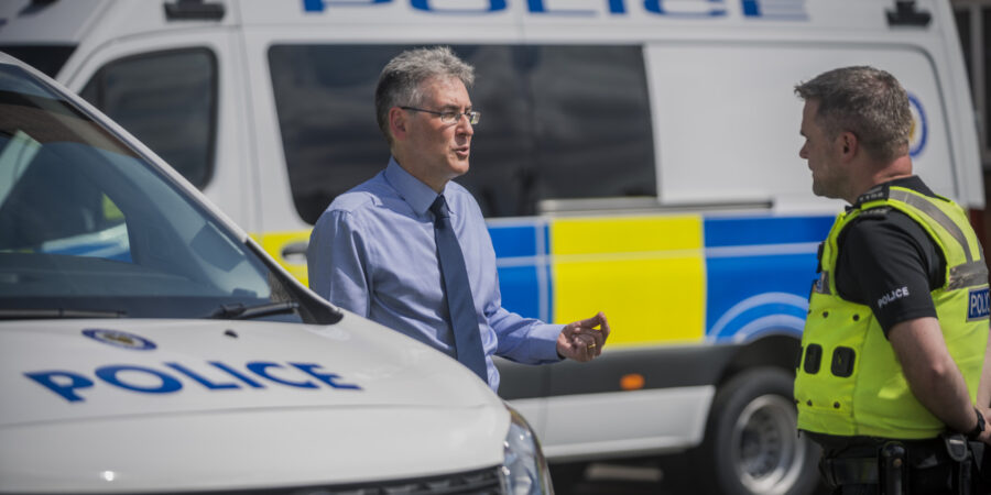 PCC Simon Foster speaks to a police officer